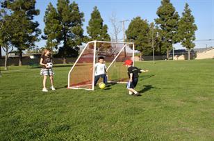 Children playing soccer.